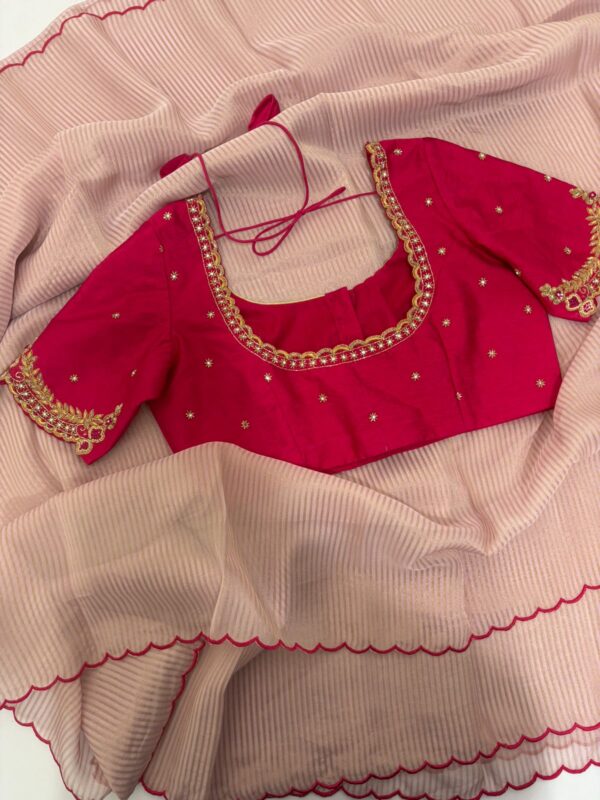 Pure tissue saree with scallop border paired with  maggam work blouse