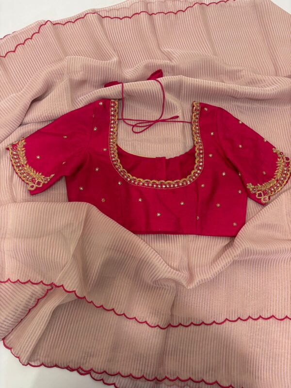 Pure tissue saree with scallop border paired with  maggam work blouse