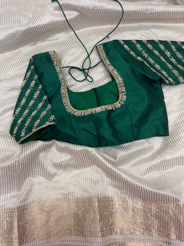 Tissue saree paired with beautiful maggam work blouse