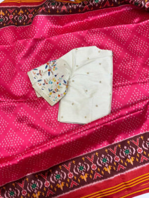Patola saree paired with beautiful maggam work blouse