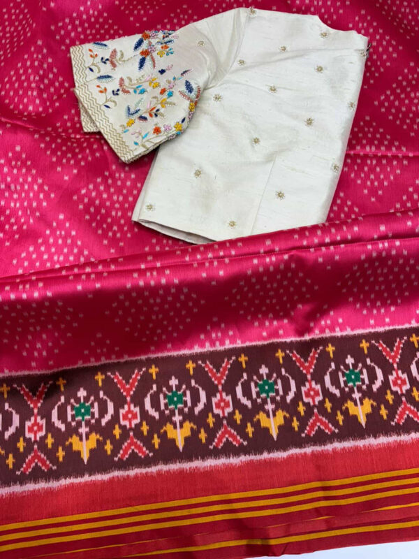 Patola saree paired with beautiful maggam work blouse