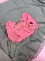 Exclusive designer kanchi organza stripes saree paired with beautiful maggam work blouse