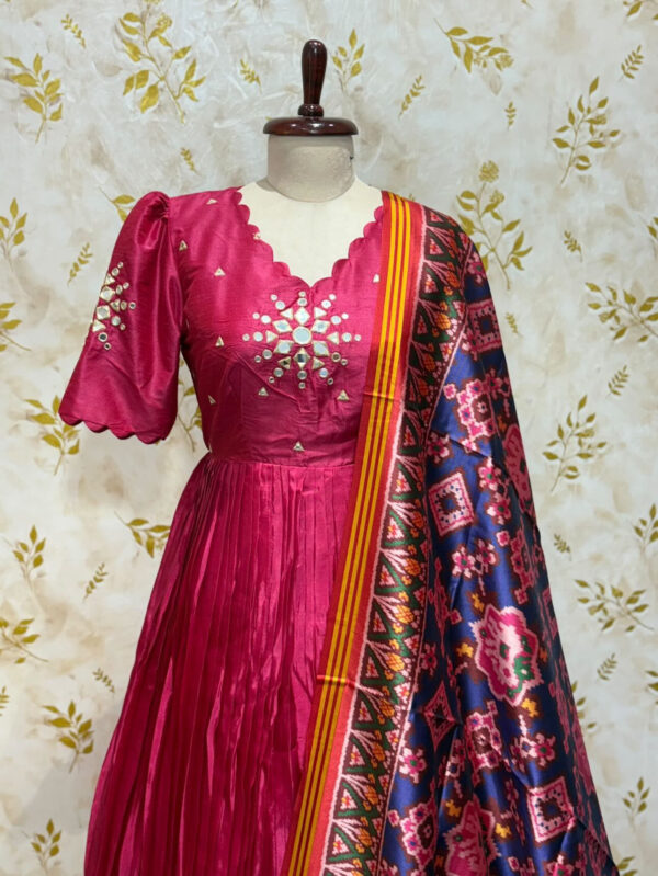Pure crepe long gown with mirror work paired with patola dupatta