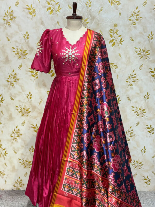 Pure crepe long gown with mirror work paired with patola dupatta