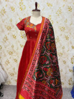 Pure crepe long gown with hand work floral design paired with patola dupatta