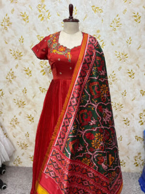 Pure crepe long gown with hand work floral design paired with patola dupatta
