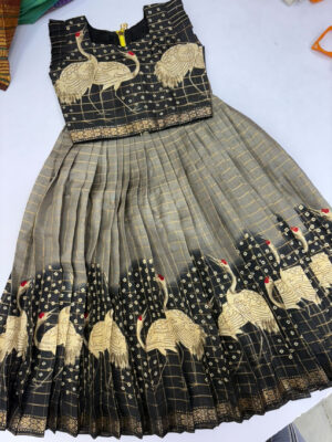 Exclusive designer skirt with swan design teamed up with pretty over coat
