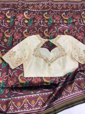 Patola silk saree paired with maggam work blouse