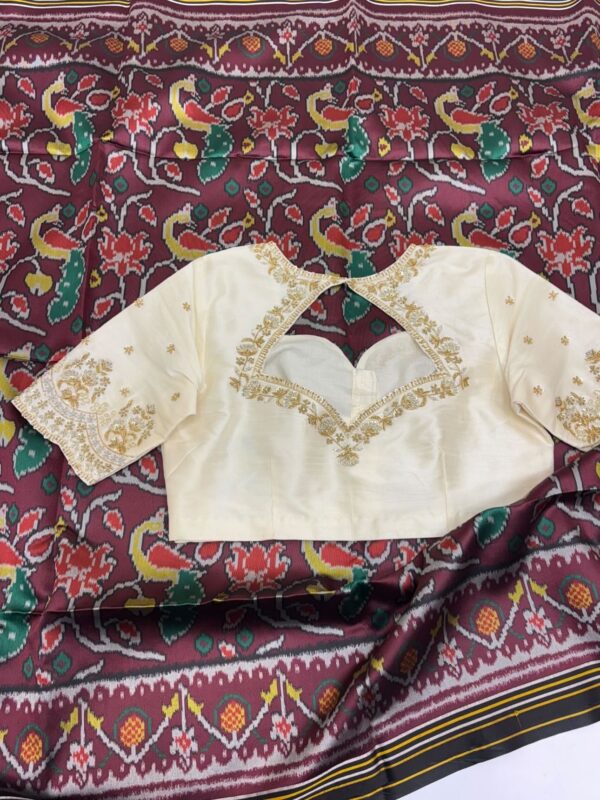Patola silk saree paired with maggam work blouse