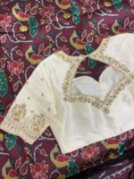 Patola silk saree paired with maggam work blouse