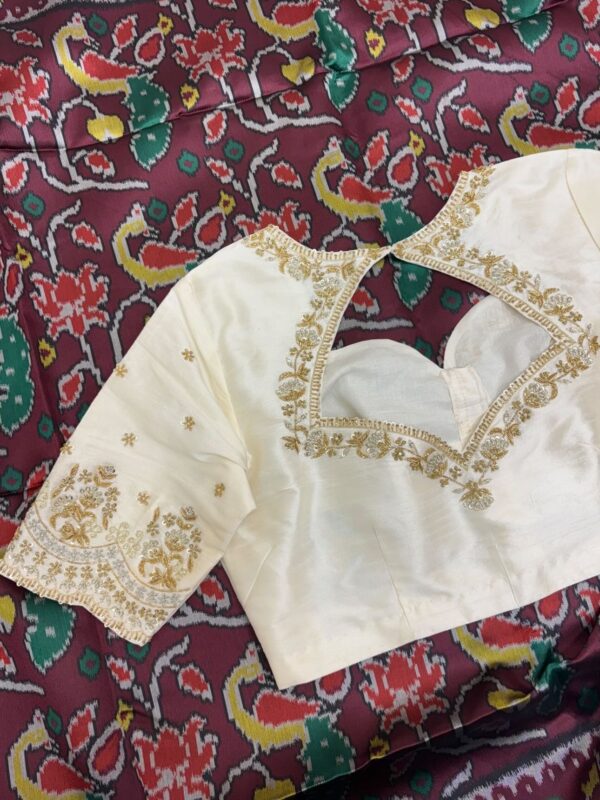 Patola silk saree paired with maggam work blouse