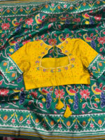 Patola silk saree paired with maggam work blouse