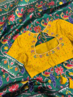Patola silk saree paired with maggam work blouse