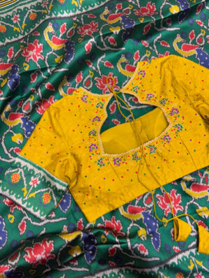 Patola silk saree paired with maggam work blouse
