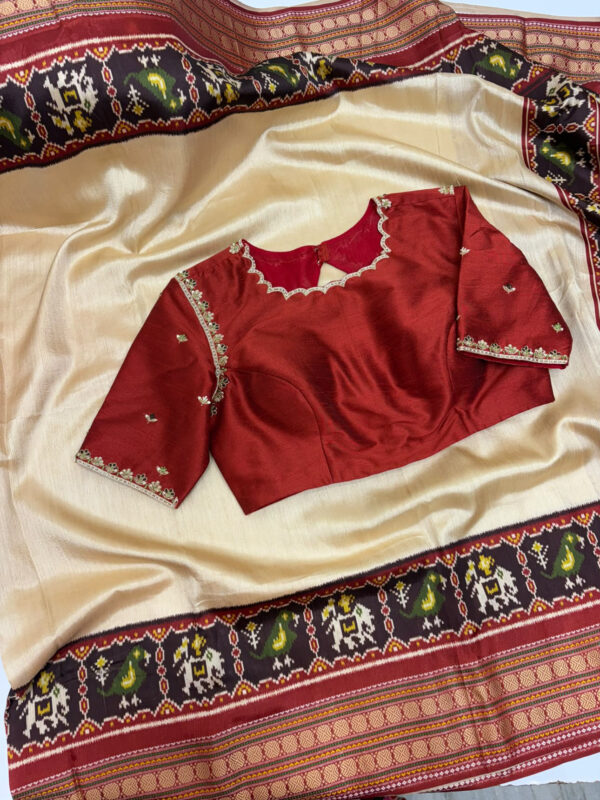 Patola silk saree paired with beautiful maggam work blouse