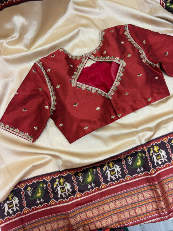 Patola silk saree paired with beautiful maggam work blouse