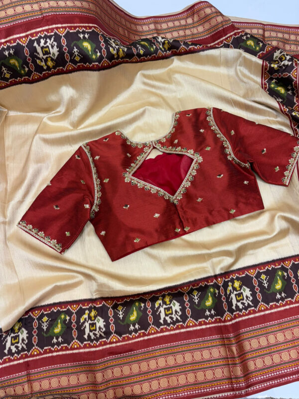 Patola silk saree paired with beautiful maggam work blouse