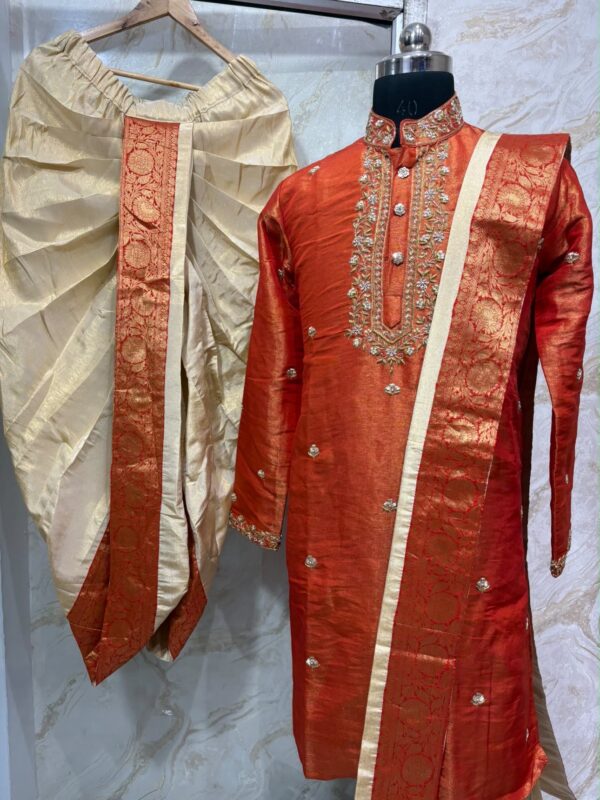 Pure tissue pattu dhoti set with heavy maggam work