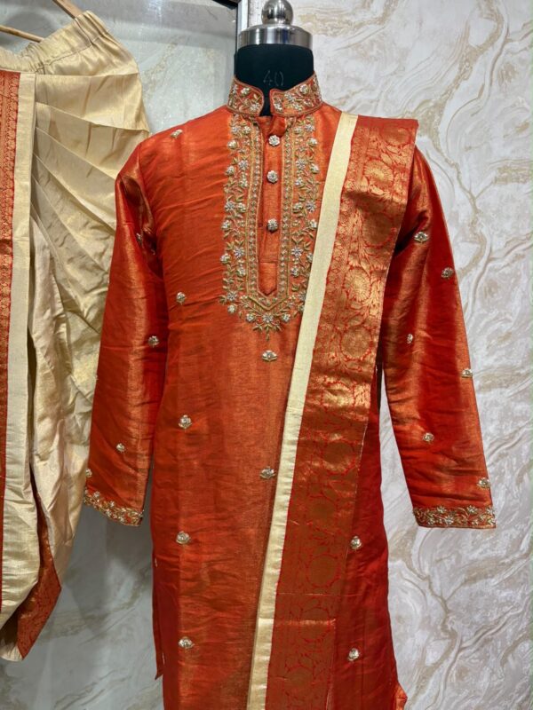 Pure tissue pattu dhoti set with heavy maggam work